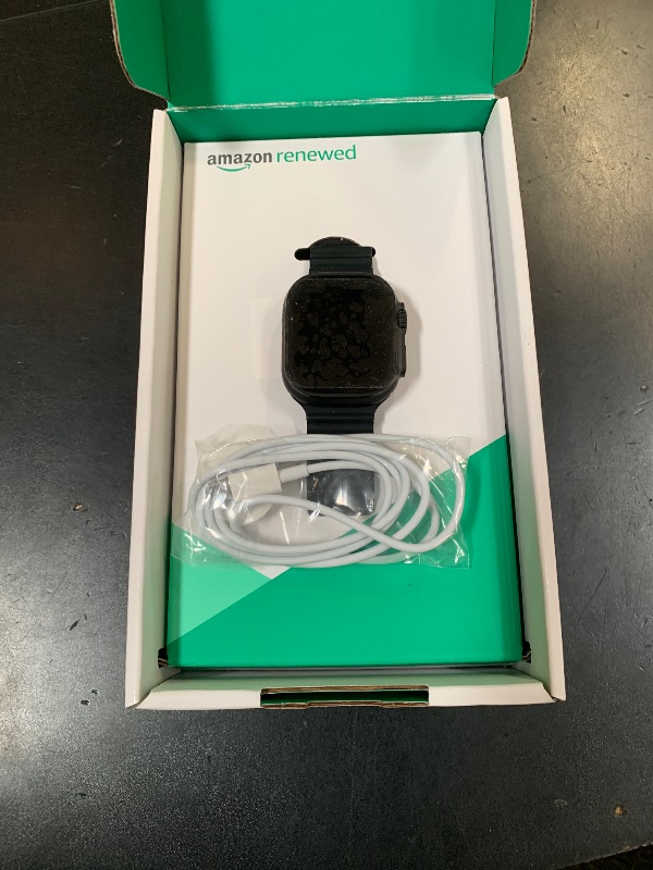 Photo 1 of Apple Watch Ultra 2 (GPS + Cellular, 49MM) - Black Titanium Case with Black Ocean Band (Renewed Premium)