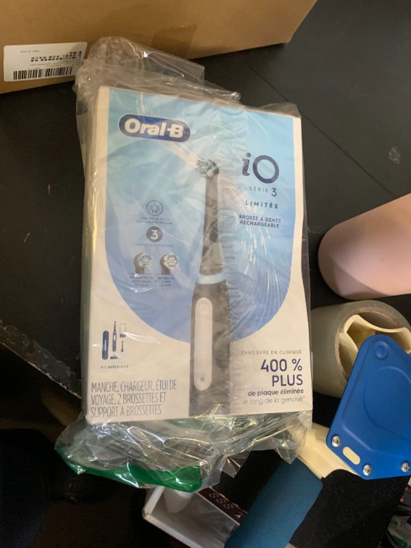 Photo 1 of Oral-B Rechargeable Electric Toothbrush, iO3 Limited Deep Clean, 3 Cleaning Modes, Visual Pressure Sensor to Protect Gums, 2 Brush Heads, Travel Case, Black