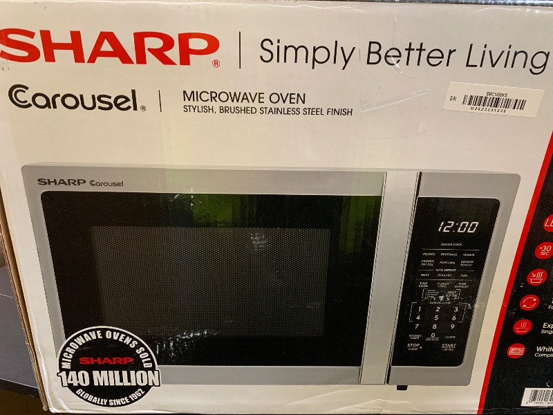 Photo 1 of SHARP Countertop Microwave Oven with Removable 12.4" Carousel Turntable, 1000 Watt, 1.1 Cubic Feet, Stainless Steel
