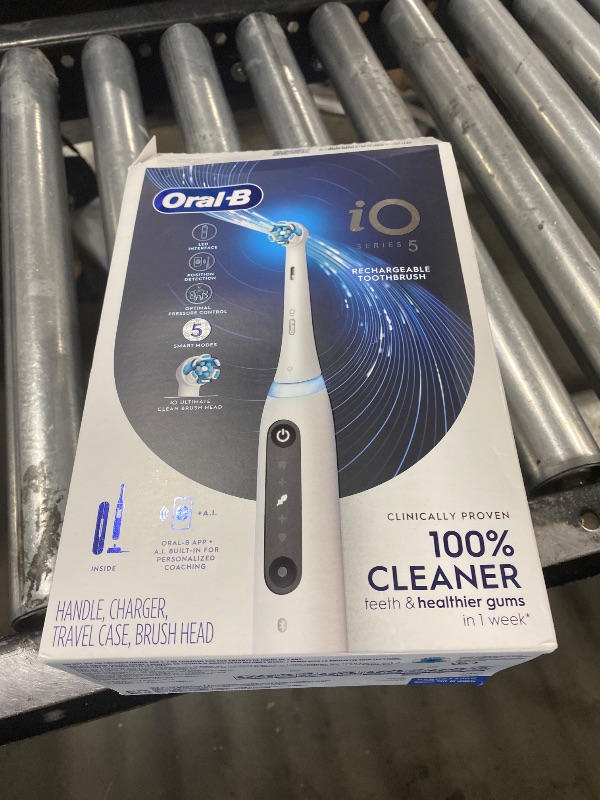 Photo 1 of Oral-B Rechargeable Electric Toothbrush, iO5 Customizable Clean, 5 Cleaning Modes, Visual Pressure Sensor to Protect Gums, Travel Case, White