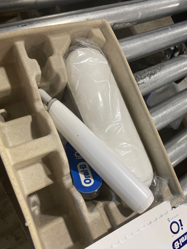 Photo 1 of Oral-B Rechargeable Electric Toothbrush, iO5 Customizable Clean, 5 Cleaning Modes, Visual Pressure Sensor to Protect Gums, Travel Case, White