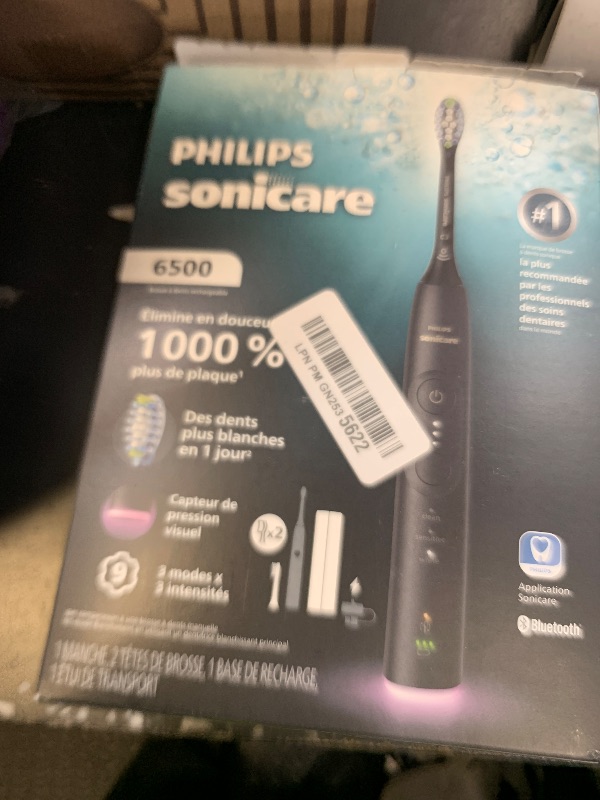 View 2 of **USED/DAMAGED** Philips Sonicare 6500 Series Electric Toothbrush - Next-Generation Sonicare Technology, Pressure Sensor, 9 Brushing Settings, SmarTimer, BrushPacer, 21-Day Runtime, Travel Case, Black, HX7411/08