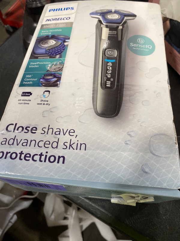 Photo 1 of Philips Norelco Shaver 7300, Rechargeable Wet & Dry Electric Shaver with SenseIQ Technology, Pop-up Trimmer, Charging Stand, Click-on Nose Trimmer, & Travel Case, S7887/92