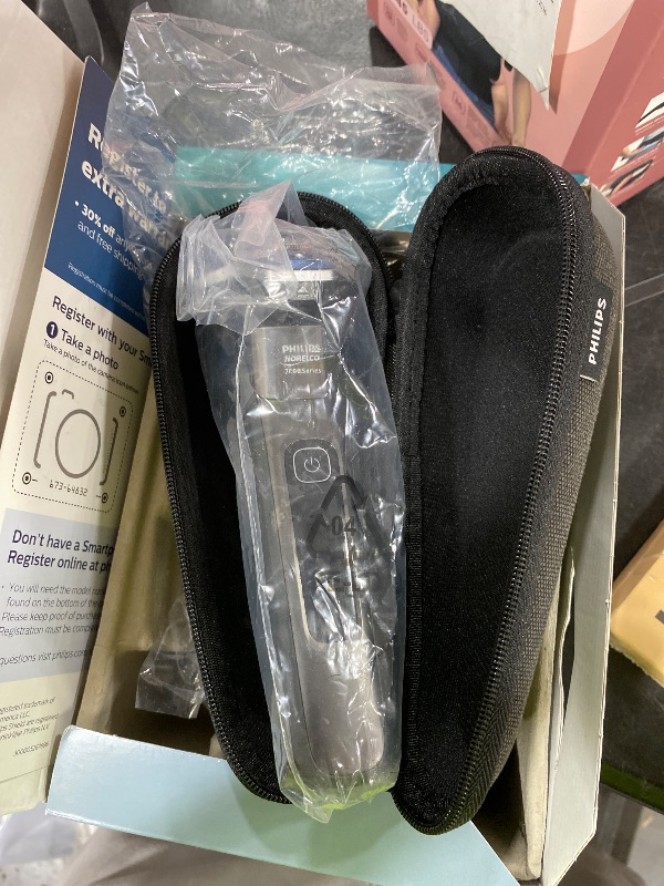 Photo 1 of Philips Norelco Shaver 7300, Rechargeable Wet & Dry Electric Shaver with SenseIQ Technology, Pop-up Trimmer, Charging Stand, Click-on Nose Trimmer, & Travel Case, S7887/92