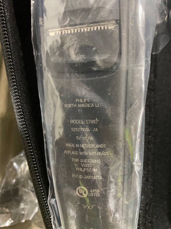 Photo 1 of Philips Norelco Shaver 7300, Rechargeable Wet & Dry Electric Shaver with SenseIQ Technology, Pop-up Trimmer, Charging Stand, Click-on Nose Trimmer, & Travel Case, S7887/92