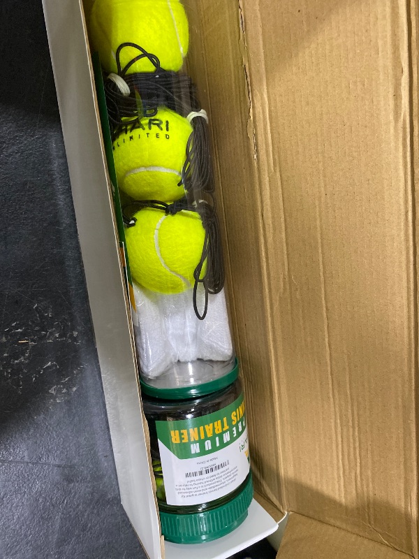 Photo 1 of Ahari Unlimited Premium Tennis Trainer Set, Pro Rebounder with Metal Base in a Carrying Cylinder, 3 Replacement Rebound Balls, & Wristband, Portable Tennis Practice Equipment for Solo Training