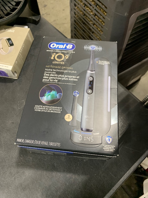 Photo 1 of Oral-B Rechargeable Electric Toothbrush, iO9 Limited Ultimate Clean, 7 Cleaning Modes, Interactive Display, iSense Charger, Charging Travel Case, Visible Pressure Sensor, 3 Brush Heads, Black