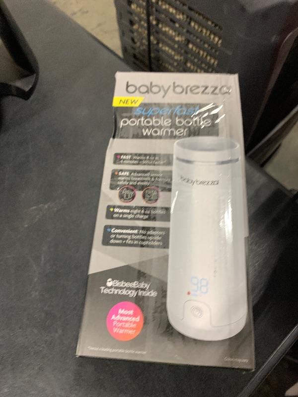Photo 1 of Baby Brezza Portable Warmer – 3X Faster Baby Bottle Warming - Travel Breastmilk and Formula Warmer - Safe, Even Heating - Up to 9oz - No Adapters, White