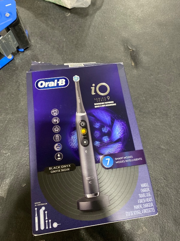 Photo 1 of Oral-B Rechargeable Electric Toothbrush, iO Series 9 Genius, Black, 4 Replacement Brush Heads, Power Charging Travel Case, Teeth Whitening, Visible Pressure Sensor to Protect Gums, 7 Modes