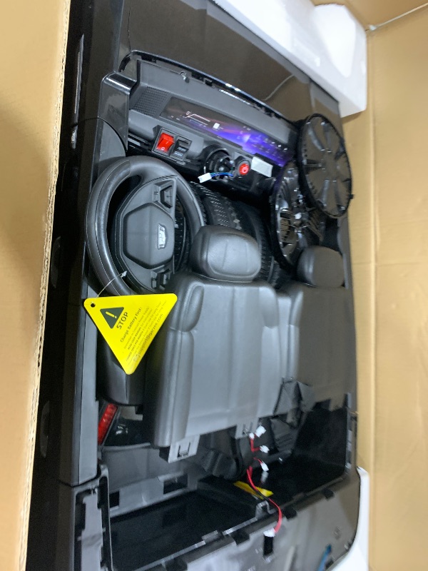 Photo 1 of 24V Kids Ride On Car Licensed Cadillac 2 Seater Ride On Truck Toy Battery Powered Electric Car for Toddlers, with Remote Control, Spring Suspension, Led Lights and Music for Boys Girls (Black)