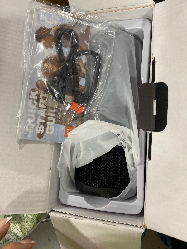 Photo 1 of JBL Flip 7 - Portable Waterproof and Drop-Proof Speaker, Bold JBL Pro Sound with AI Boost, 16Hrs of Playtime, and PushLock System with Interchangeable Accessories (Black)