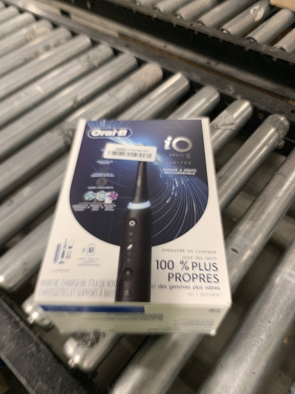 Photo 1 of Oral-B Rechargeable Electric Toothbrush, iO5 Limited Deep Clean & Whiten, 5 Cleaning Modes, Visual Pressure Sensor to Protect Gums, Travel Case, 3 Brush Heads, Black