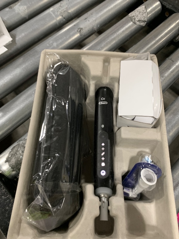 Photo 1 of Oral-B Rechargeable Electric Toothbrush, iO5 Limited Deep Clean & Whiten, 5 Cleaning Modes, Visual Pressure Sensor to Protect Gums, Travel Case, 3 Brush Heads, Black