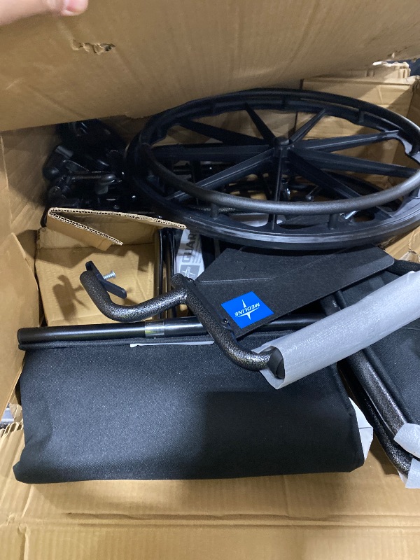 Photo 1 of Medline Comfortable Folding Wheelchair with Swing-Back, Desk-Length Arms and Elevating Footrests, 20”W x 16”D Seat
