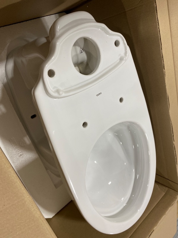 Photo 1 of TOTO Drake Transitional Two-Piece Elongated 1.28 GPF Universal Height TORNADO FLUSH Toilet with CEFIONTECT, Cotton White - CST786CEFG#01