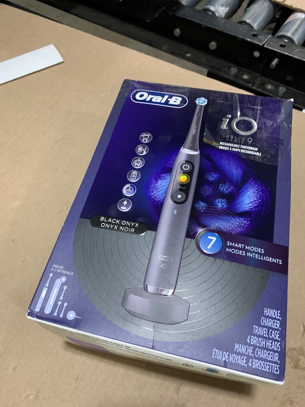 Photo 1 of Oral-B Rechargeable Electric Toothbrush, iO Series 9 Genius, Black, 4 Replacement Brush Heads, Power Charging Travel Case, Teeth Whitening, Visible Pressure Sensor to Protect Gums, 7 Modes