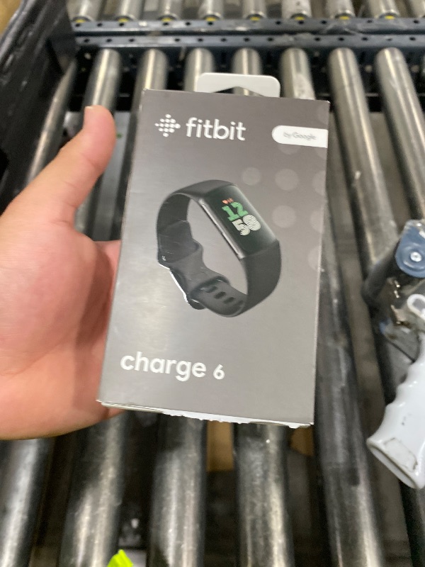 Photo 1 of Fitbit Charge 6 Fitness Tracker with Google Apps - Heart Rate on Exercise Equipment - 3-Month Google Health Premium Membership Included - Health Tools - Obsidian/Black - Small&Large Bands Included