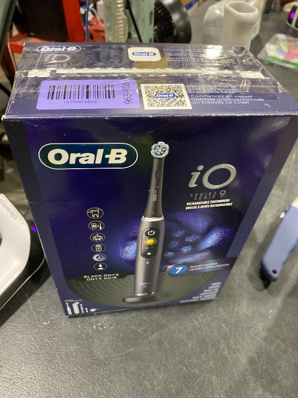 Photo 1 of Oral-B Rechargeable Electric Toothbrush, iO Series 9 Genius, Black, 4 Replacement Brush Heads, Power Charging Travel Case, Teeth Whitening, Visible Pressure Sensor to Protect Gums, 7 Modes