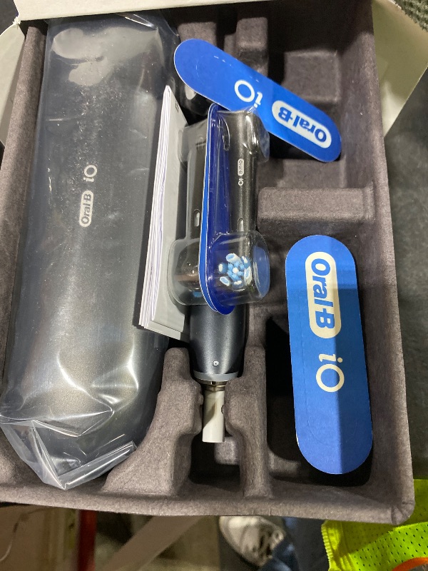 Photo 1 of Oral-B Rechargeable Electric Toothbrush, iO Series 9 Genius, Black, 4 Replacement Brush Heads, Power Charging Travel Case, Teeth Whitening, Visible Pressure Sensor to Protect Gums, 7 Modes