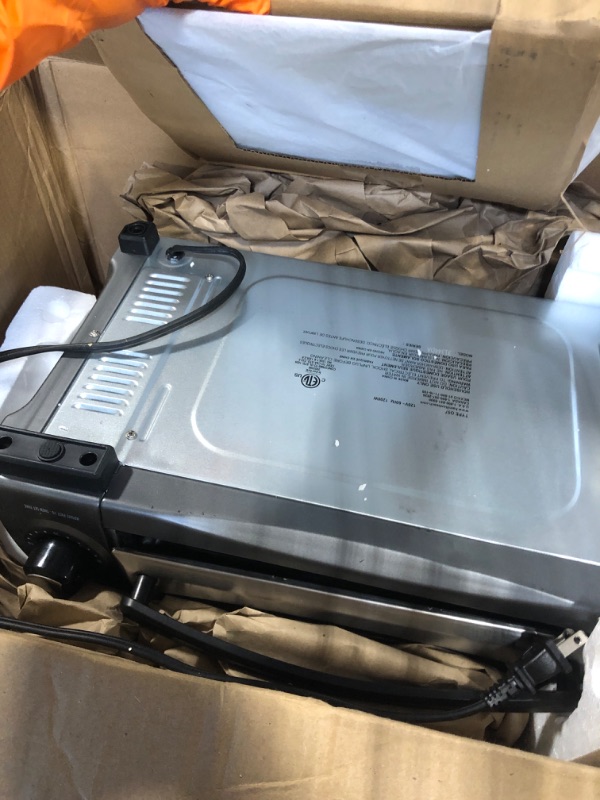 Photo 1 of ** ONLY PARTS/ DAMAGE MAJOR** Hamilton Beach Easy Reach 4-Slice Countertop Toaster Oven With Roll-Top Door, 1200 Watts, Fits 9” Pizza, 3 Cooking Functions for Bake, Broil and Toast, Silver (31344DA)