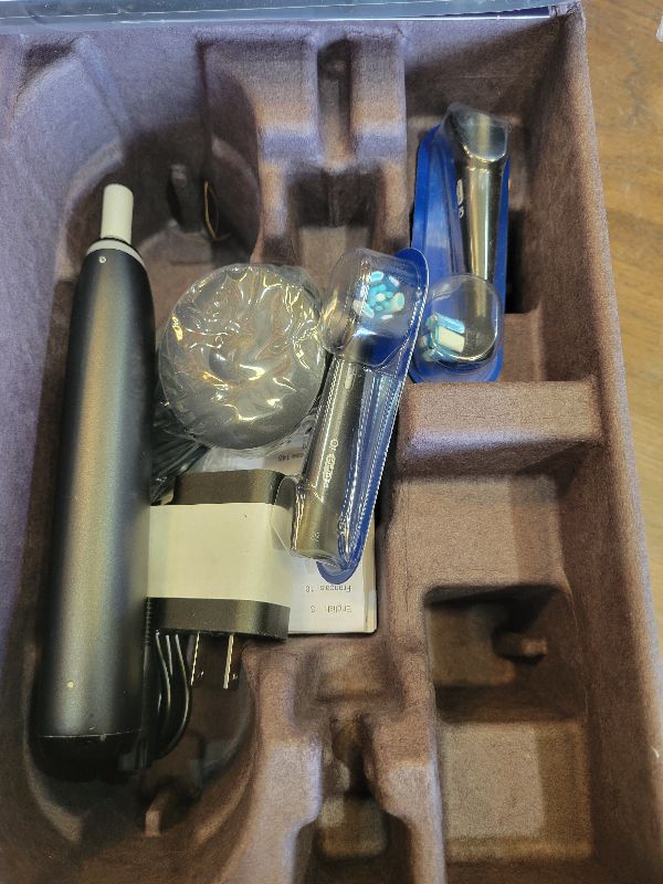 Photo 1 of Oral-B Rechargeable Electric Toothbrush, iO Series 9 Genius, Black, 4 Replacement Brush Heads, Power Charging Travel Case, Teeth Whitening, Visible Pressure Sensor to Protect Gums, 7 Modes