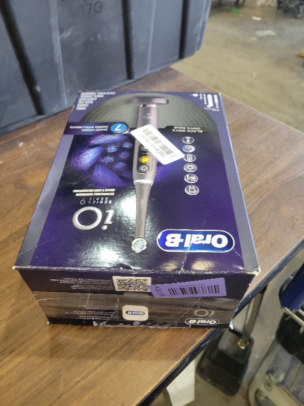 Photo 1 of Oral-B Rechargeable Electric Toothbrush, iO Series 9 Genius, Black, 4 Replacement Brush Heads, Power Charging Travel Case, Teeth Whitening, Visible Pressure Sensor to Protect Gums, 7 Modes
