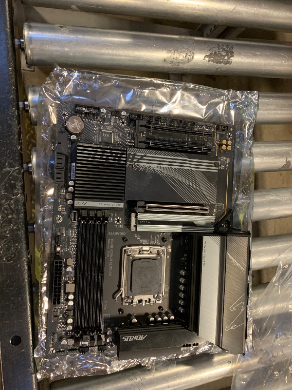 Photo 1 of GIGABYTE B650 AORUS Elite AX AMD AM5 ATX Motherboard, Support Ryzen 9000/8000/7000 Series, DDR5, 14+2+1 Power Phase, PCIe 5.0 M.2, USB-C 3.2 Gen 2, WIFI6E, 2.5GbE, EZ-Latch, Q-Flash, RGB Fusion