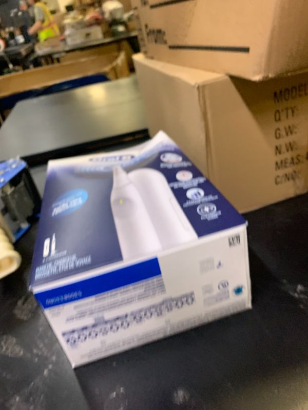 Photo 1 of Oral-B Rechargeable Electric Toothbrush, iO Limited Simple Clean, 3 Cleaning Modes, Automatic Pressure Sensor to Protect Gums, Travel Case, White