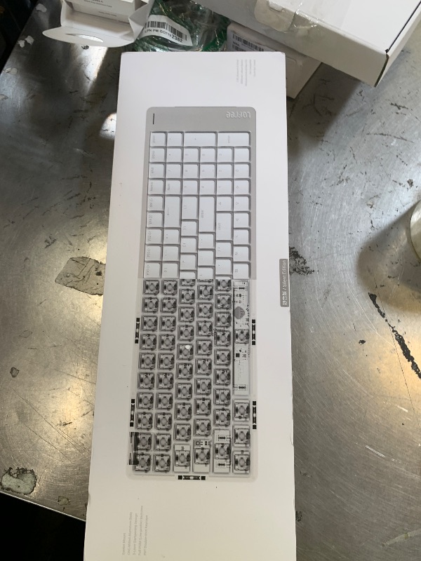 Photo 1 of LOFREE Flow Low Profile Mechanical Keyboard, 100 Keys Rechargeable Wireless Keyboards with Bluetooth and Wired Connection for Windows, Mac OS/White Ghost Linear Switches