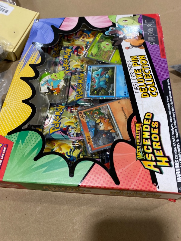 View 2 of MAJOR DAMAGE-----------------OPENED------------------MISSING CARDS--------------selling for parts only-------------------Pokémon TCG: Mega Evolution First Partners Deluxe Pin Collection
