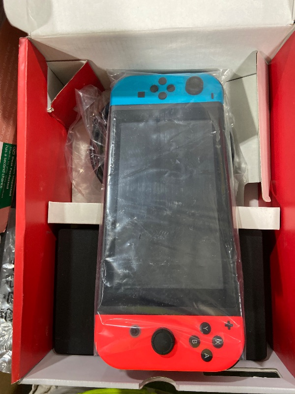 Photo 1 of Nintendo Switch with Neon Blue and Neon Red Joy-Con - Handheld Gaming Console
