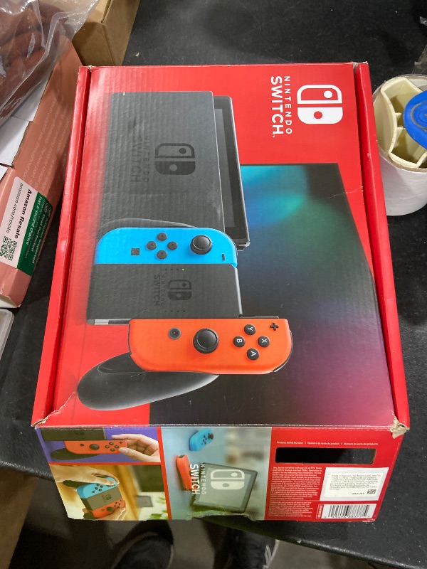 Photo 1 of Nintendo Switch with Neon Blue and Neon Red Joy-Con - Handheld Gaming Console