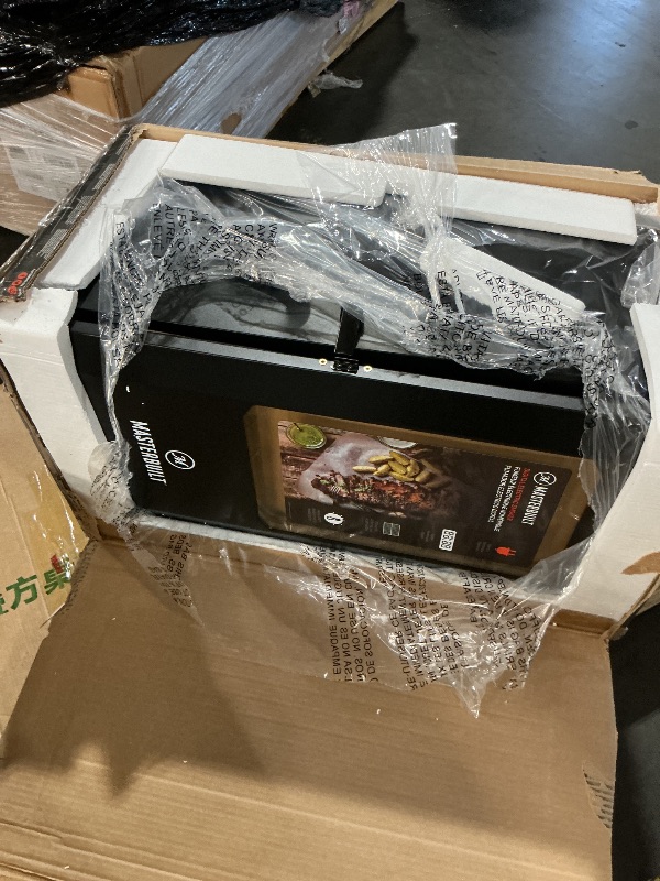 Photo 1 of ***MAJOR DAMAGE TO TOP*** Masterbuilt® 30-inch Digital Electric Vertical BBQ Smoker with Leg Kit, Side Wood Chip Loader and 710 Cooking Square Inches in Black, Model MB20070421