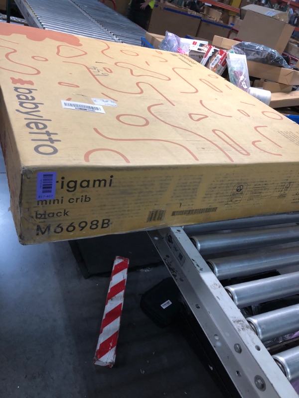 Photo 1 of ***FACTORY SEALED - OPENED FOR INSPECTION***Babyletto Origami Mini Portable Folding Crib with Wheels in Black, 2 Adjustable Mattress Positions, Greenguard Gold Certified