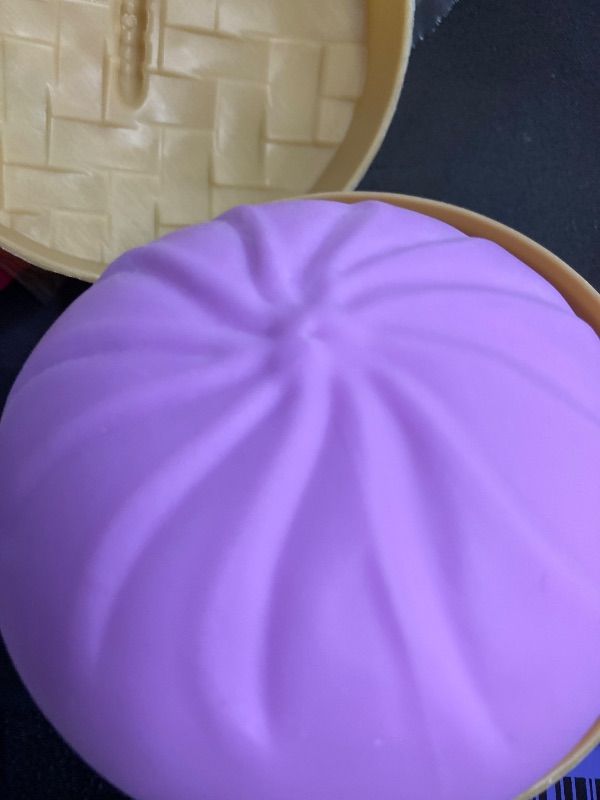 Photo 1 of **HAS NO FACE***Dumpling Squishies, Glitter Dumpling Mystery Box, 2026 Upgraded Dumplings Stress Balls Fidget Sensory Balls, Squeeze Dough Ball Stress Relief Hand with Food Steamer, Relaxation Gift (Purple)
