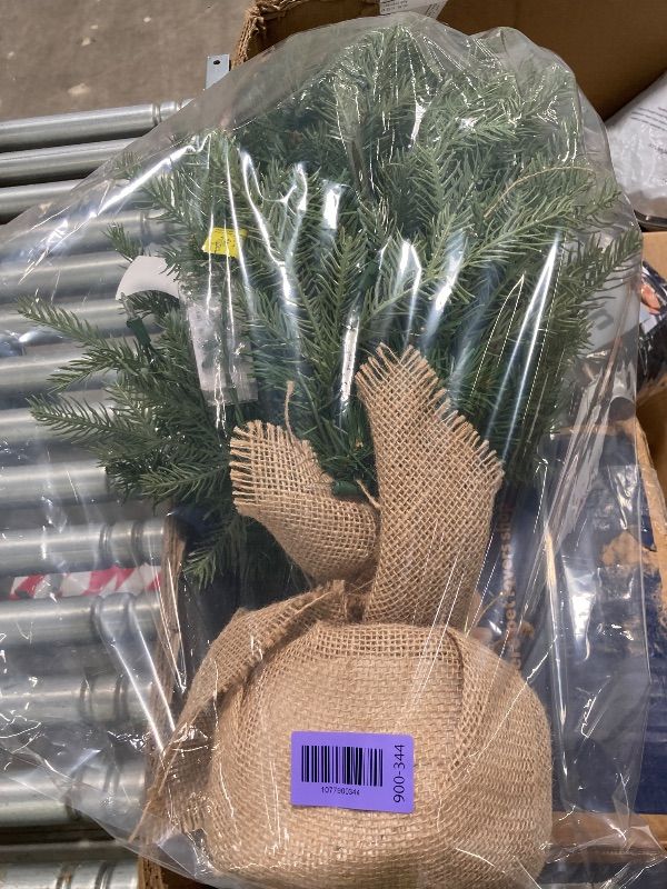 Photo 1 of **BASE IS DAMAGED***National Tree Company 3 ft Pre-Lit Nordic Spruce Mini Artificial Christmas Tree, 100 Clear Lights, 363 Tips, Burlap Base, Green