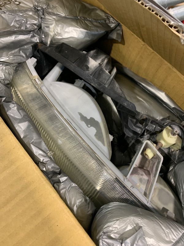 Photo 1 of ***VERY USED*** Dorman 1590119 Passenger Side Headlight Assembly Compatible with Select Chevrolet Models