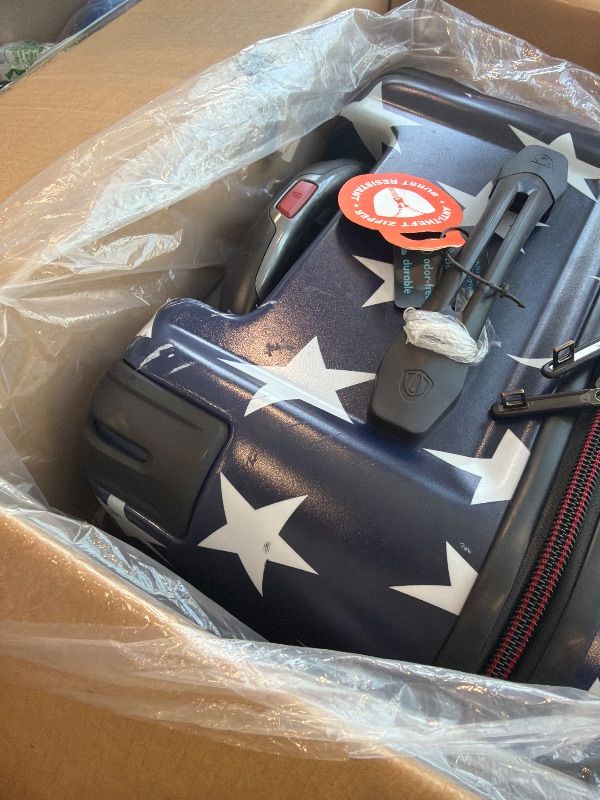 Photo 1 of ****MINOR DAMAGE**** Traveler's Choice Maxporter II Polycarbonate Hardside Trunk with Spinner Wheels, American Flag, 31-Inch Large Trunk
