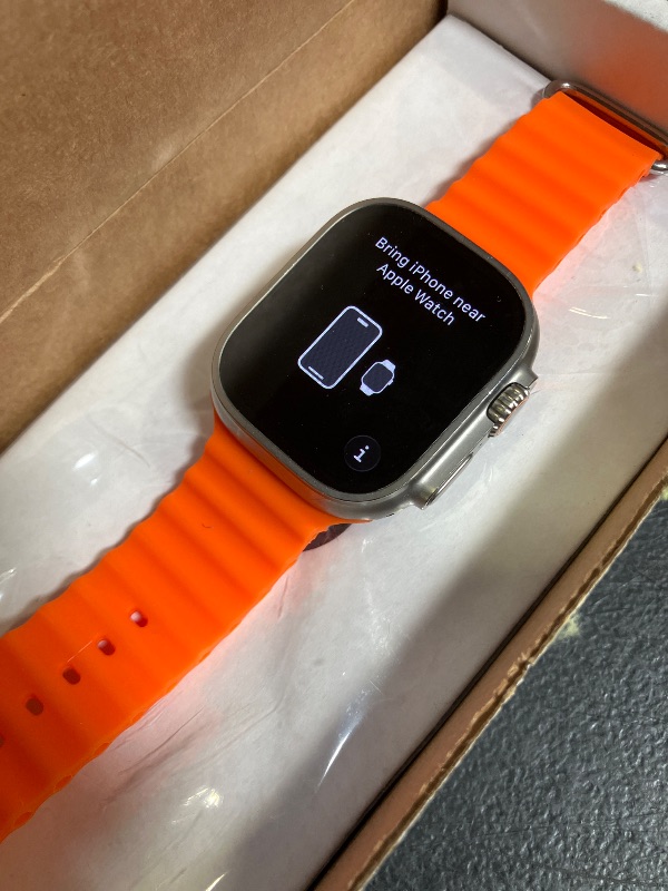 Photo 1 of Apple Watch Ultra 2 [GPS + Cellular, 49mm] - Titanium Case with Orange Ocean Band, One Size (Renewed)