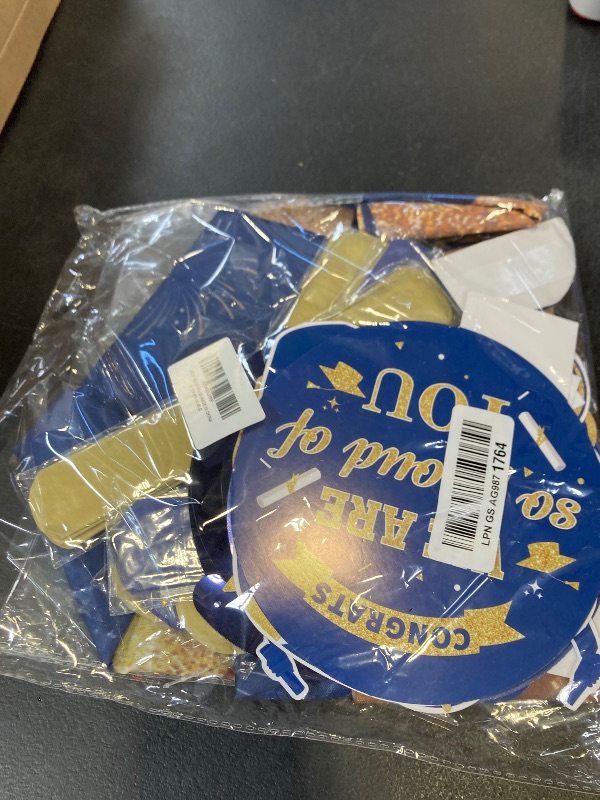 Photo 1 of Navy Blue and Gold Graduation Decorations Class of 2026 Grad Party Decor Pack: Congrats Grad Banner and Graduation Backdrop with Graduate Centerpieces Hanging Swirls Tissue Pom Poms Flower Set