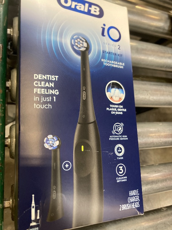 Photo 1 of Oral-B Rechargeable Electric Toothbrush, iO2 Starter Kit, 3 Cleaning Modes, Automatic Pressure Sensor to Protect Gums, 2 Brush Heads, Night Black
