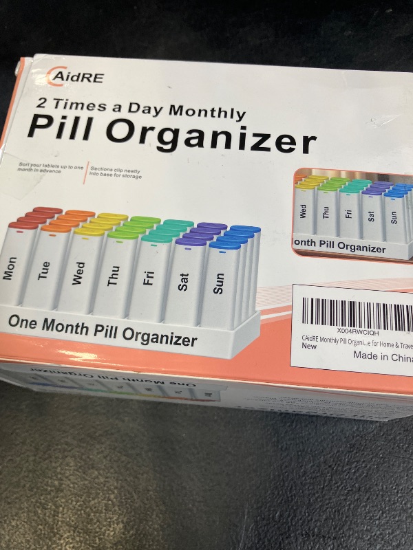 Photo 1 of CAidRE Monthly Pill Organizer 2 Times a Day - 28 Day Pill Box AM PM, Extra Large Capacity 4 Week Pill Case for Vitamins and Medication, Moisture-Resistant Travel Friendly Individual Pods, White