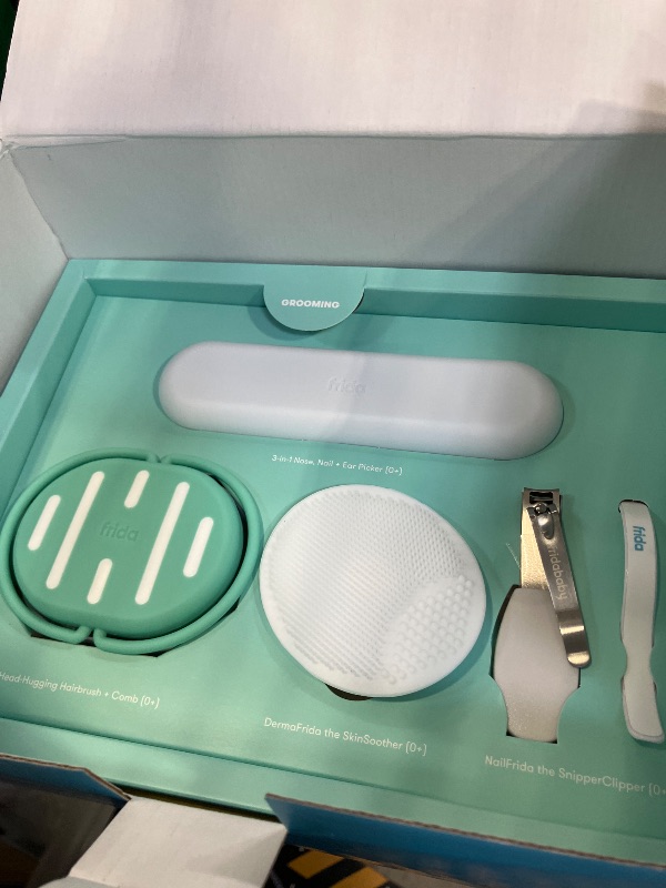Photo 1 of Frida Baby Ultimate Baby Kit, 10 piece New Born Essentials Gift Set Includes Wellness Sick Day, Gas Relief, Grooming Tools & Teething Toys