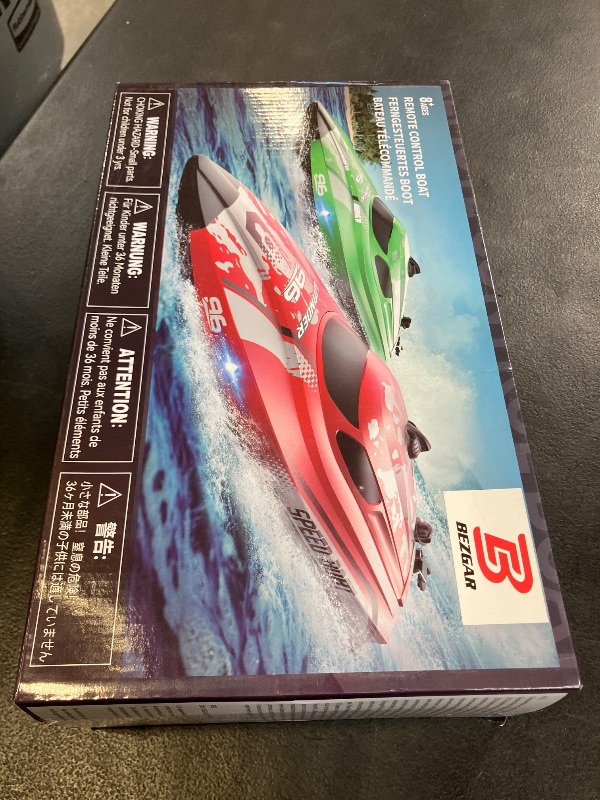View 2 of BEZGAR RC Boat, 12 inch Remote Control Boat for Kids and Adults, 25 KPH Fast RC Speed Boats with 700mAh Battery, Ideal Waterproof Toy Boats for Lakes & Pools - TX126 Red