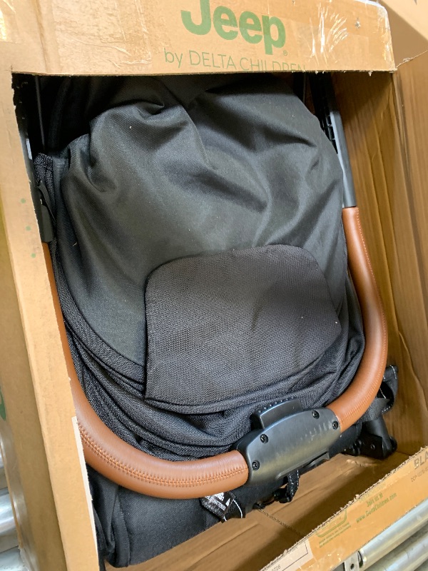 Photo 1 of Jeep Altitude Compact Travel Stroller by Delta Children Greenguard Gold, Easy One Hand Fold, Lightweight, Extendable Canopy with Peek-a-Boo Window, Reclining Seat, 4 Wheel Suspension, Black