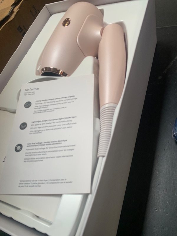 Photo 1 of T3 Afar Lightweight Travel-Size Hair Dryer with Auto Dual Voltage, Folding Handle, Fast Drying, Lightweight and Ergonomic, Frizz Smoothing, Multiple Heat and Speed Combinations