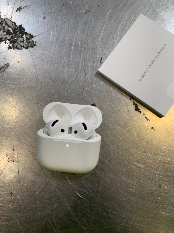 Photo 1 of Apple AirPods 4 Wireless Earbuds, Bluetooth Headphones, with Active Noise Cancellation, Adaptive, Transparency Mode, Personalized Spatial Audio, USB-C Charging Case, Wireless Charging, H2 Chip