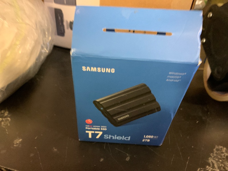 Photo 1 of Samsung T7 Shield 2TB, Portable SSD, up-to 1050MB/s, USB 3.2 Gen2, Rugged,IP65 Water & Dust Resistant, for Photographers, Content Creators and Gaming, Extenal Solid State Drive (MU-PE2T0S/AM), Black
