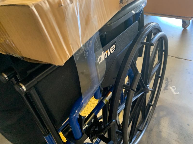 Photo 1 of Drive Medical Blue Streak Lightweight Foldable Wheelchair - Enhanced Mobility Support - Durable Construction - Padded Comfort - Swing-Away Leg Rests - Desk Arms - Blue/Black - 16 Inch Seat