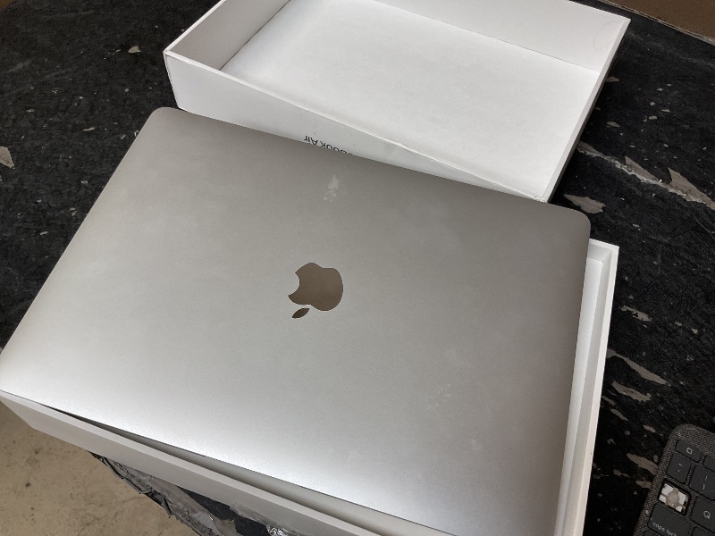 Photo 1 of **SELLING FOR PARTS**2020 Apple MacBook Air Laptop: Apple M1 Chip, 13” Retina Display, 8GB RAM, 256GB SSD Storage, Backlit Keyboard, FaceTime HD Camera, Touch ID. Works with iPhone/iPad; Silver *READ CLERK NOTES**